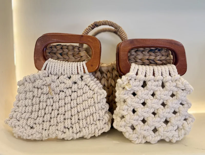 Two cream macrame boho bags with wooden handles and gold shell charms